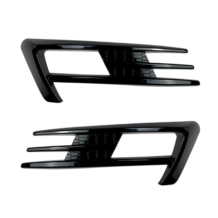 Pair of black fog light air knife trim inserts with glossy slotted design