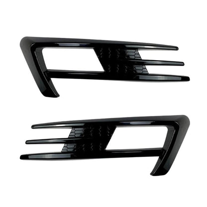 Pair of black fog light air knife trim inserts with glossy slotted design