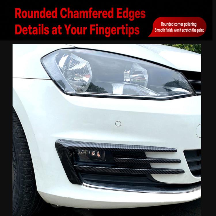 Black fog light air knife trim on front bumper, slatted insert detail