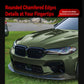 Installed black front lip spoiler on a green car front bumper