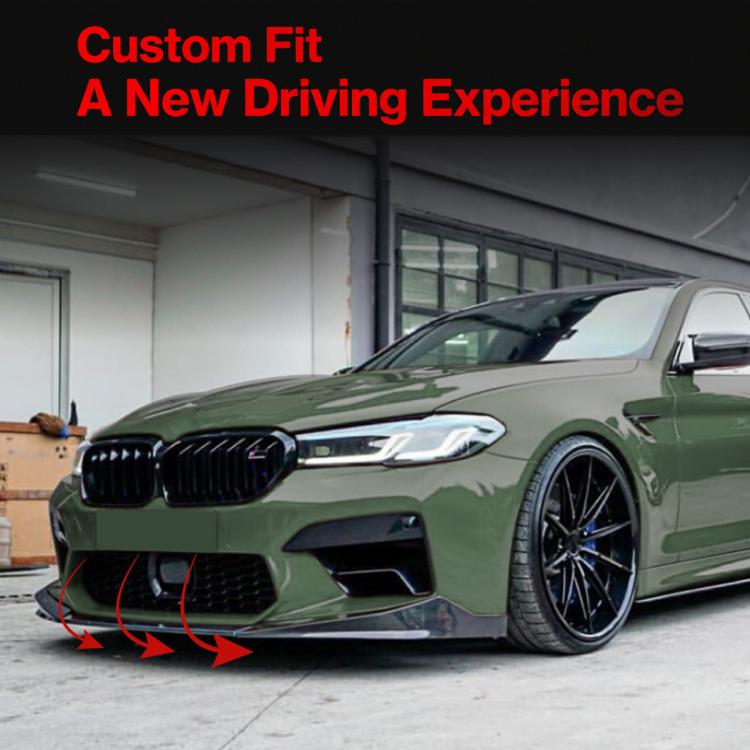 Installed black front lip spoiler on a green car front bumper