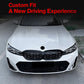 BMW front grille installed, black honeycomb mesh on a white sedan