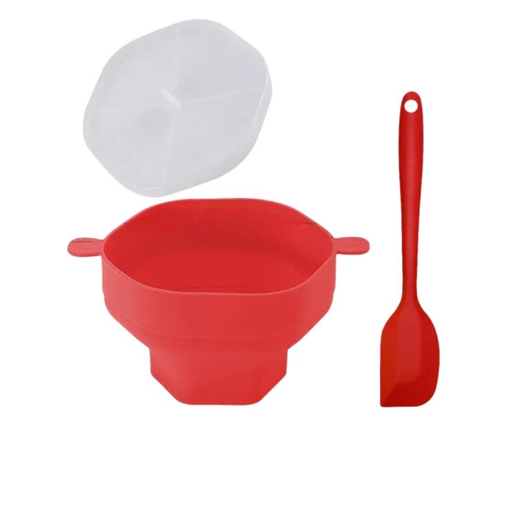 Red microwave popcorn popper bowl with clear lid and red silicone spatula