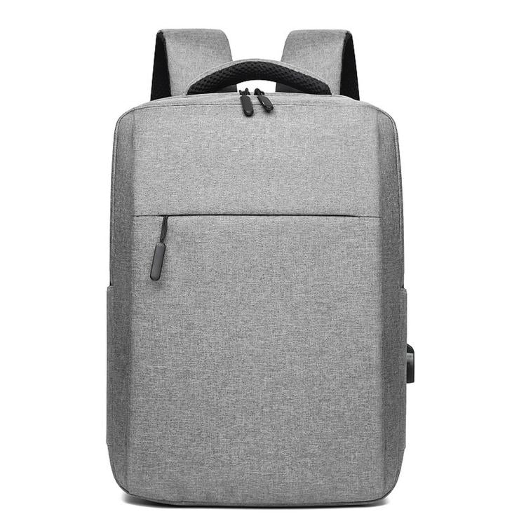 Gray laptop backpack with top handle, front zipper pocket, and padded shoulder straps