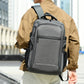 Gray laptop backpack with wide front panel, zipper compartments, and padded shoulder straps