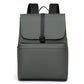 Green water-resistant laptop backpack with top flap and front zipper pocket