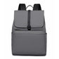 Gray water-resistant laptop backpack with top flap and front zipper pocket