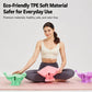 Pink pelvic floor trainer held on lap during home exercise, with wide cushioned seat