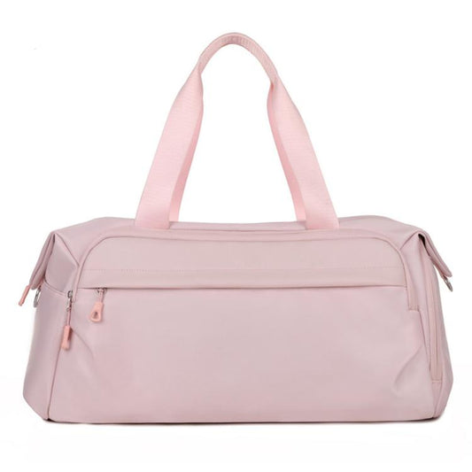 Pink water-resistant sports gym bag with top handles and zip front pocket