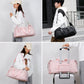 Pink and black travel duffel bag with top handles, shoulder strap, and side pockets