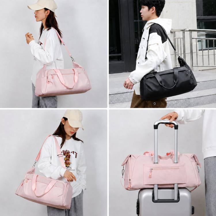 Pink and black travel duffel bag with top handles, shoulder strap, and side pockets