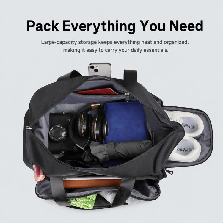 Open black sports gym bag showing organized storage and shoe compartment area