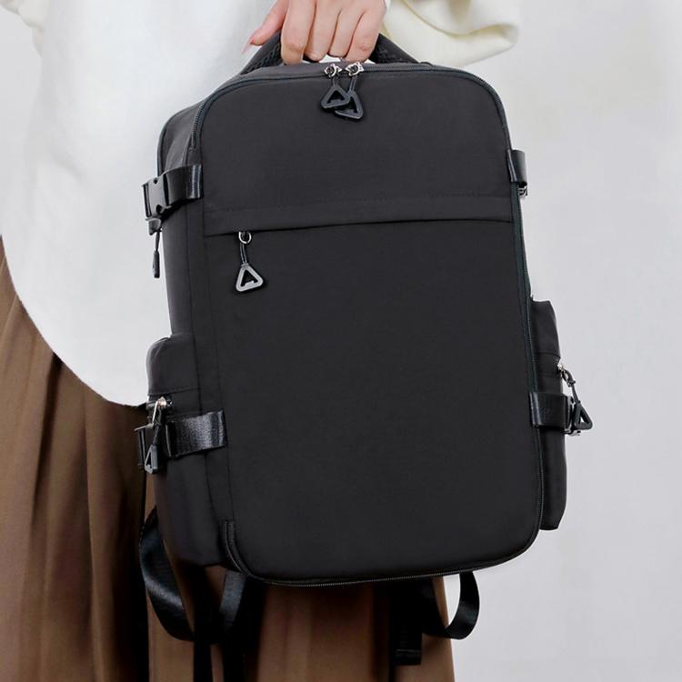 Black laptop backpack worn on a person with front and side straps
