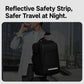 Black travel laptop backpack with reflective safety strip and top handle.