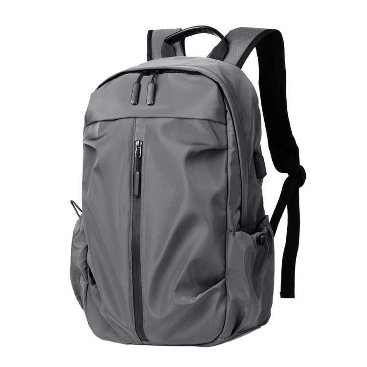 Gray casual laptop backpack with top handle, front zip pocket, and side draw strap.