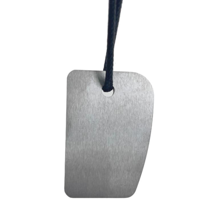 Car paint denibbing blade, rectangular silver metal piece with black hanging cord