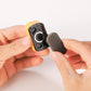 Mini magnetic paint file held in hands; black frame with round metal magnet and textured pad