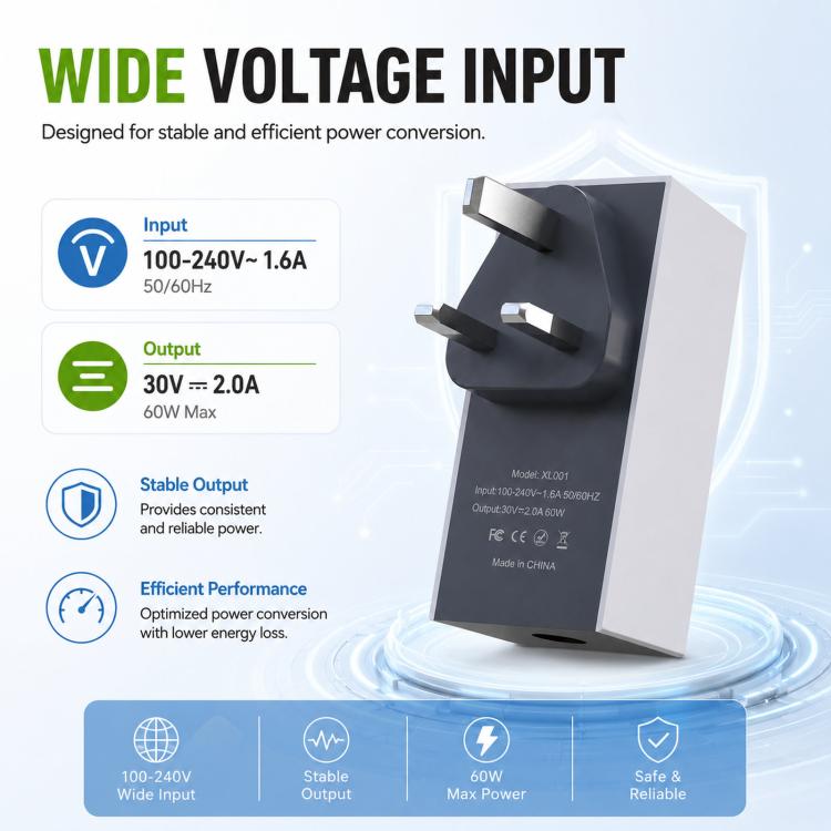 Compact UK power adapter, black and gray with plug prongs on front