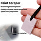 Metal paint scraper tool held in hand with black cord loop