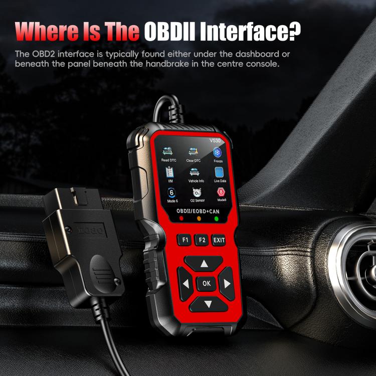 Red OBD2 scanner plugged into vehicle dashboard, handheld diagnostic controller