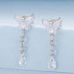 Butterfly stud earrings with crystal teardrop drops and linked chain tassels