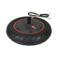 Rear hub motor wheel with black tire, orange rim ring, and top-mounted cable