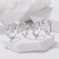 Set of star and butterfly hoop earrings with silver-tone clear rhinestone details