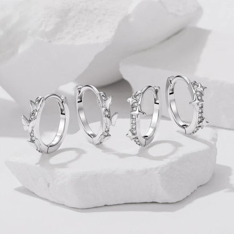 Set of star and butterfly hoop earrings with silver-tone clear rhinestone details