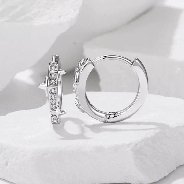 Silver-tone star and butterfly hoop earrings with rhinestone vertical charm row