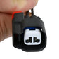 Wheel speed sensor connector plug with two-wire terminal ports, held in hand