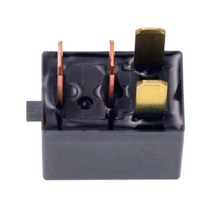 Close-up of black 4-pin relay with copper and brass contacts inside base