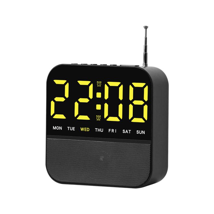 Black digital LED alarm clock radio with yellow time display and day-of-week lights