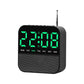 Black digital LED alarm clock radio with green time display and day-of-week lights