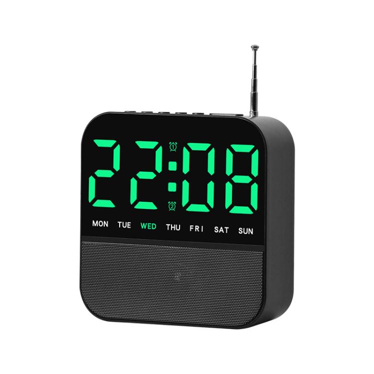Black digital LED alarm clock radio with green time display and day-of-week lights
