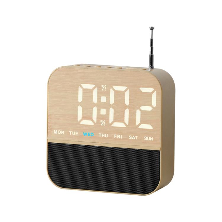 Beige digital LED alarm clock radio with white time display and day-of-week lights