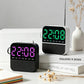 Two LED alarm clock radios: one green, one pink/purple time display with day lights