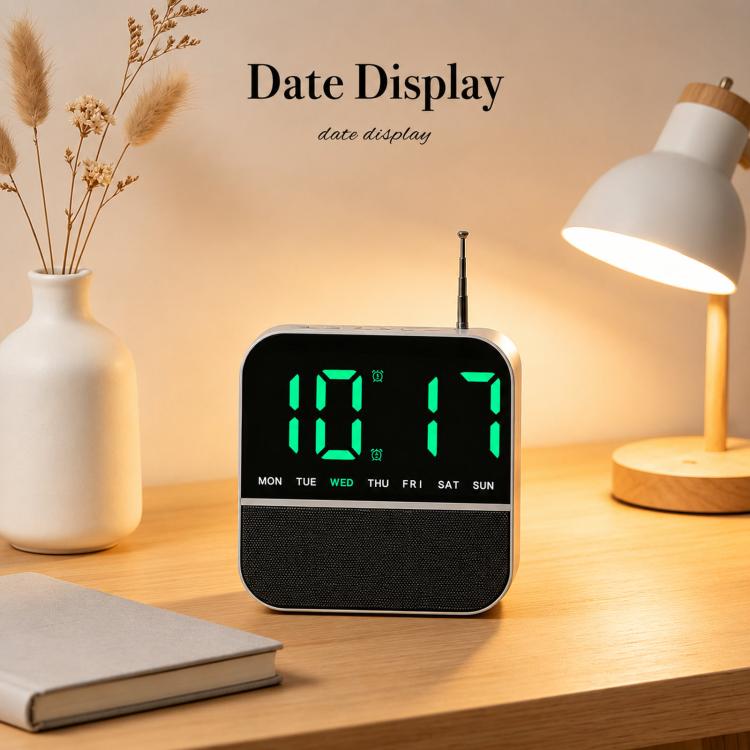 Black digital LED alarm clock radio with green date display and day-of-week lights