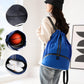 Blue drawstring sports backpack with separate shoe compartment, worn by a person