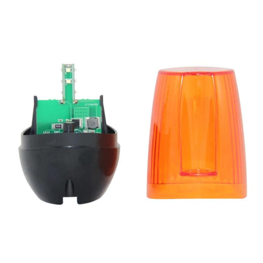 Garage door strobe light with amber lens and exposed green circuit board