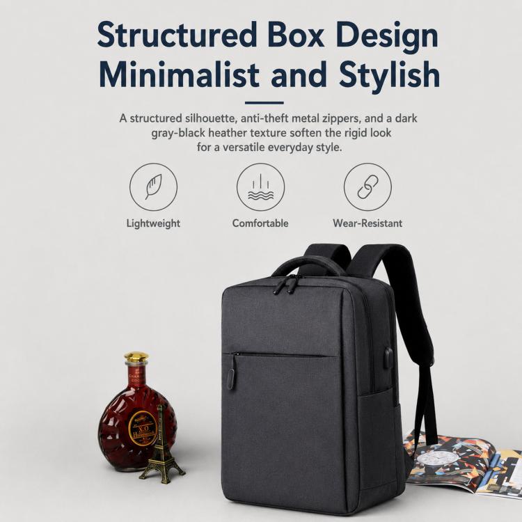 Structured black laptop backpack with boxy shape and top carry handles