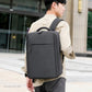 Black laptop backpack worn on shoulders with front pocket and top carry handle