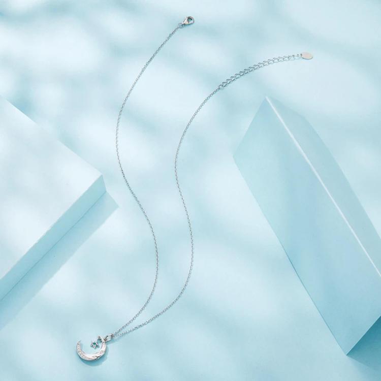 Star and moon pendant necklace with crescent moon charm, silver-tone chain