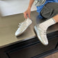 Women's silver square-toe ballet-style flat slip-on shoes with double buckles