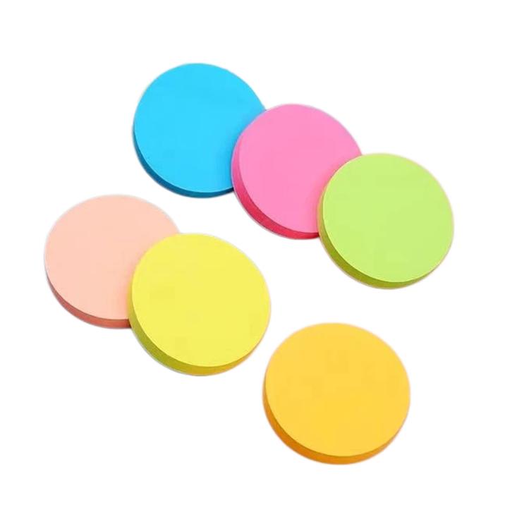 Round sticky memo notes in pastel colors: blue, pink, green, yellow, and peach.