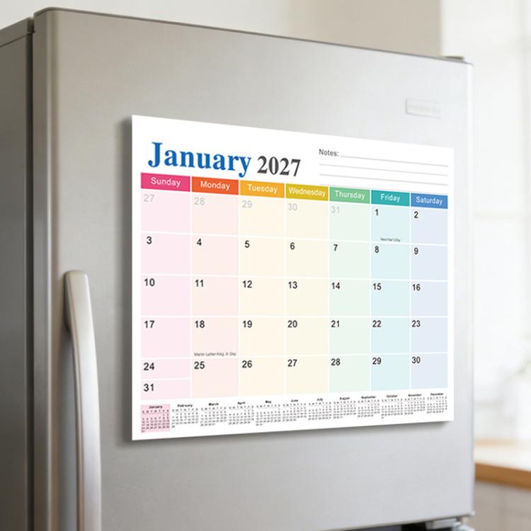 Magnetic fridge calendar pad on refrigerator door, January 2027 monthly view.
