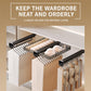 Slide-out closet organizer rack with black wire tiers and hanging hooks for clothes