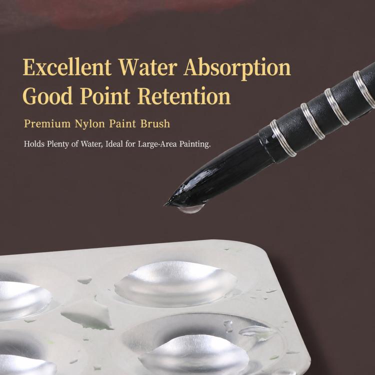 Watercolor nylon paint brush with pointed tip over a small paint-well tray