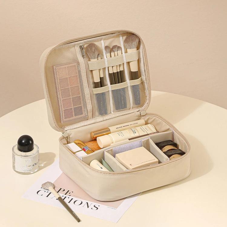 Beige makeup bag organizer with zip-top, mesh divider pocket, and brush holder slots