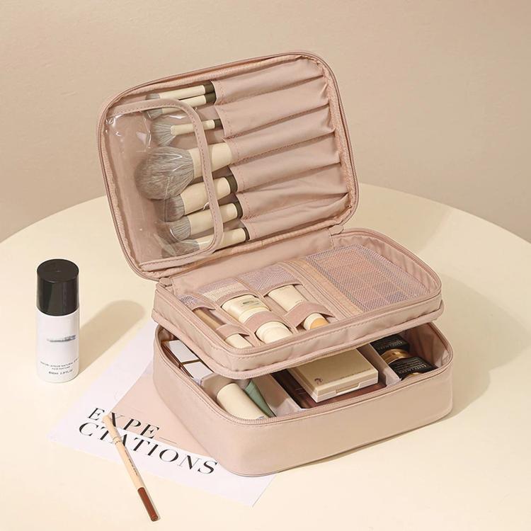 Pink double-layer makeup organizer bag with adjustable dividers and brush holder slots