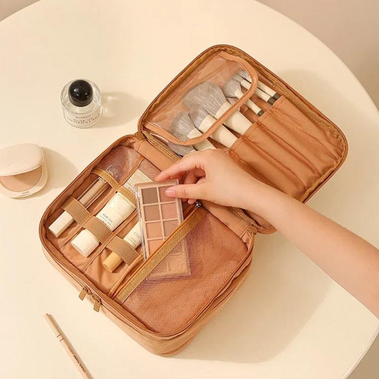Brown makeup bag organizer open with mesh panel, brush slots, and divided compartments